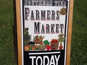 Breadboard sign with "Southern Tier Farmers' Market Today"