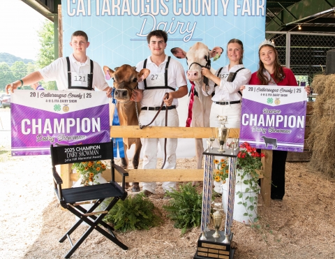 Cattaraugus County 4-H Members pose with their awards following the 4-H/FFA Dairy Cattle Show at the 2025 Cattaraugus County Fair. (L-R Kaleb Durow, Caden Herman, Olivia Shawley, and Cattaraugus County Dairy Ambassador- Kierra Knobloch.)