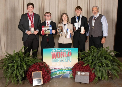 The NYS 4-H Dairy Judging Team poses with their awards at the World Dairy Expo (Left to Right: Hayden Ayers, Dayne Jantzi, Olivia Shawley, Larsen Swan, Coach Doug Waterman)